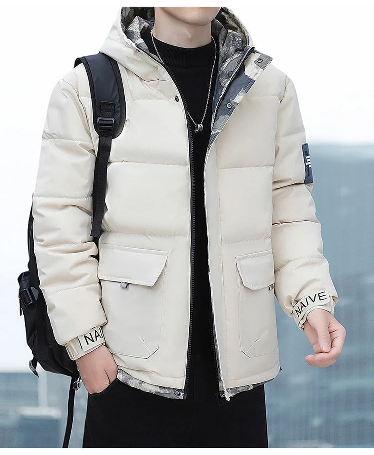 Person wearing a beige puffer jacket with a blurred background
