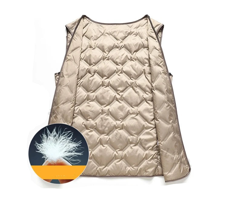 Beige quilted vest with a close-up of goose down on a white background