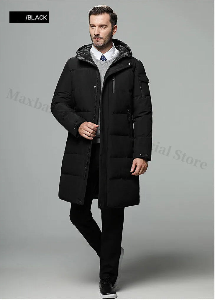 Man wearing a black coat on a gray background