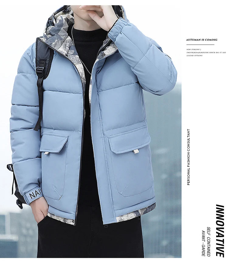 Person wearing a blue puffer jacket with camouflage lining, standing against a blurred outdoor background.