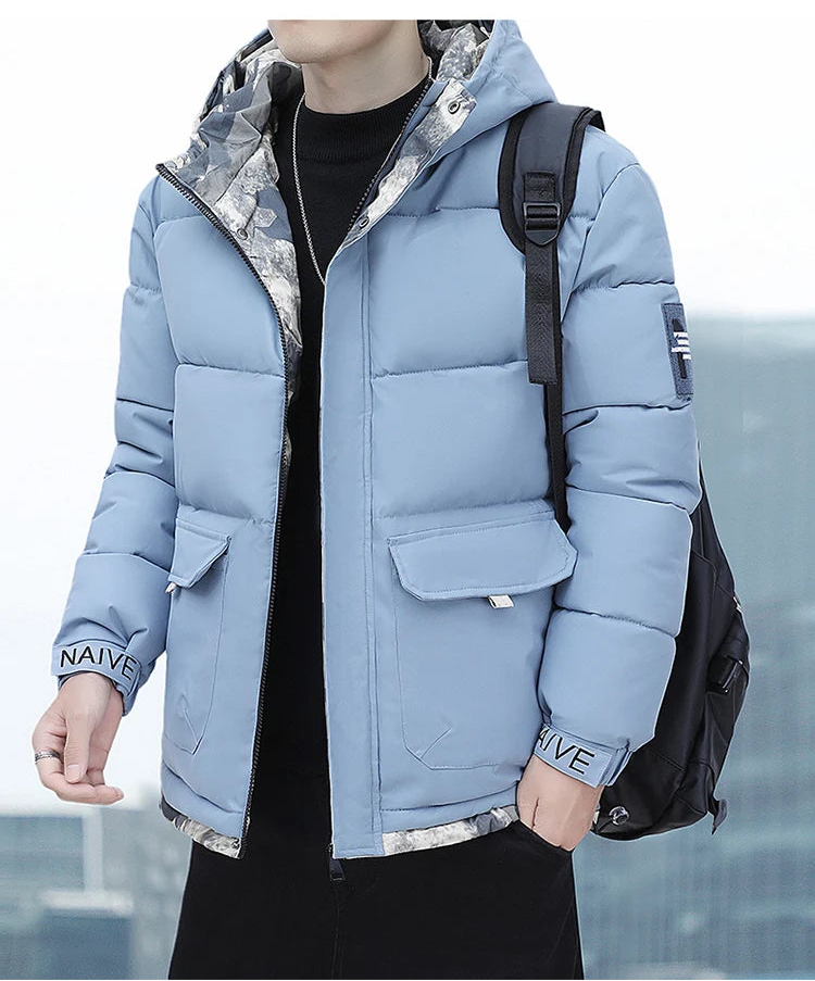 Person wearing a light blue puffer jacket with a blurred background