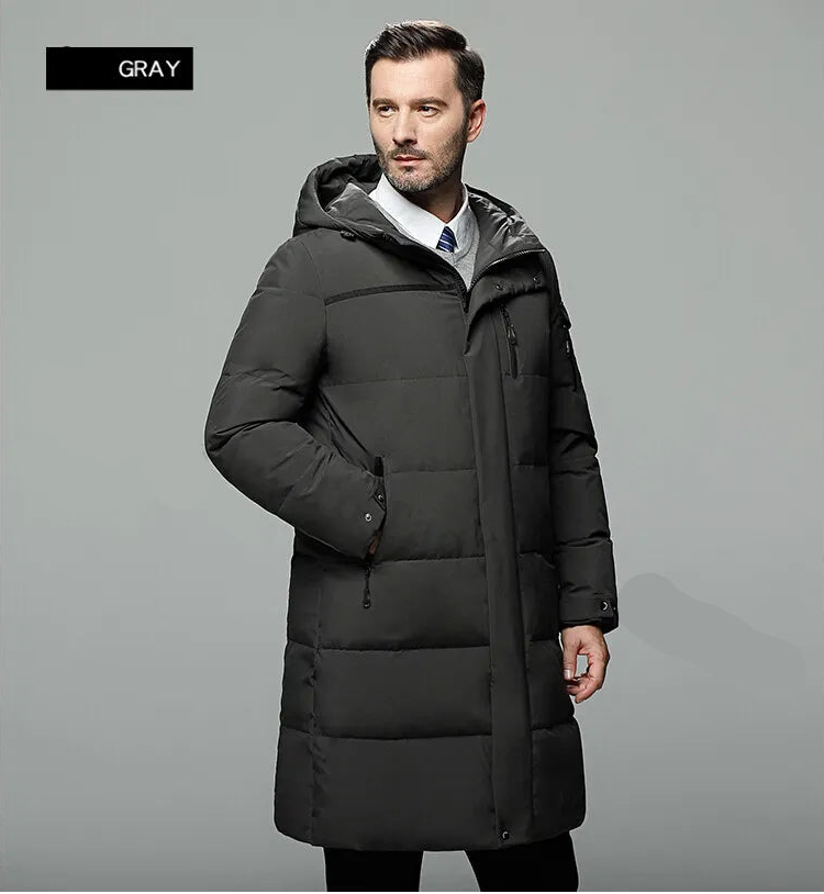 Man wearing a gray winter coat with Maxba brand logo on a gray background